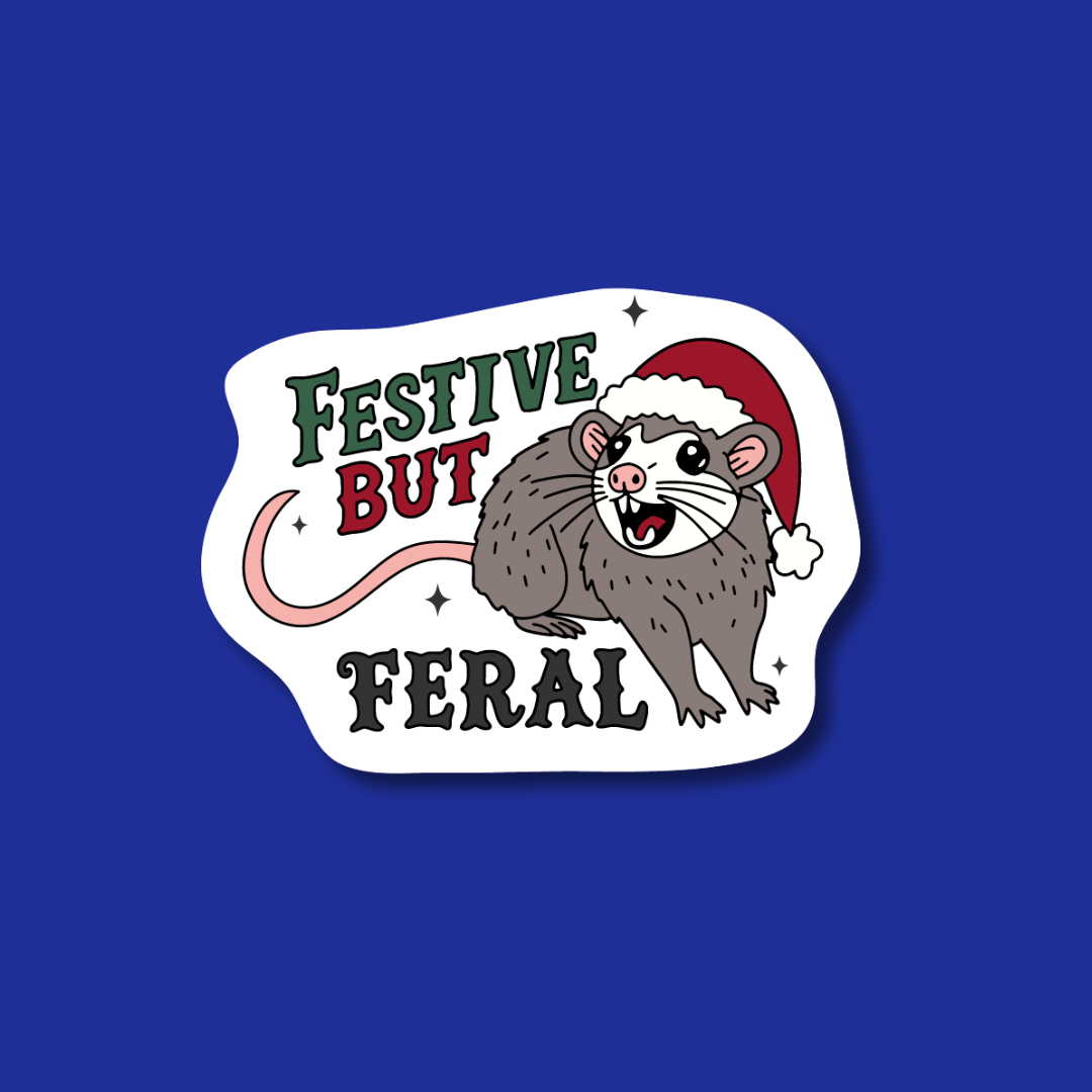 A sticker with a cartoon rat wearing a Santa hat and the text "Festival but Feral" against a blue background.