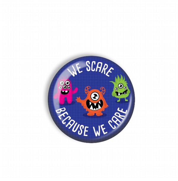 A blue button with a cartoon monster design and the text "WE SCARE BECAUSE WE CARE" printed on it.