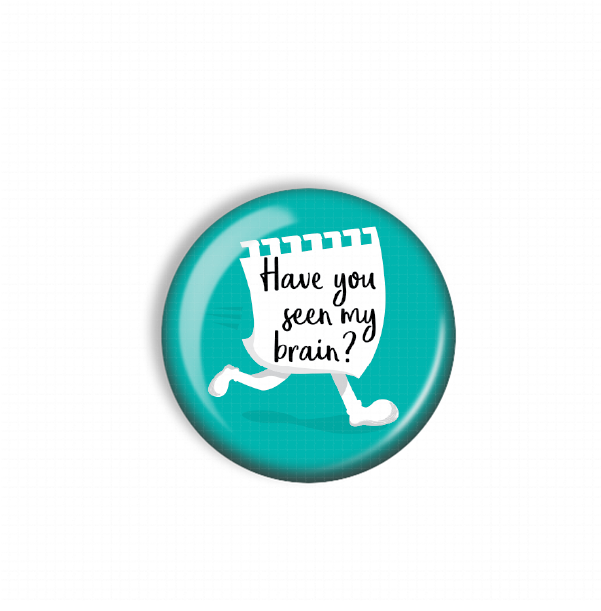 A turquoise button with a white paper cutout of a person's legs and the text "Have you seen my brain?"