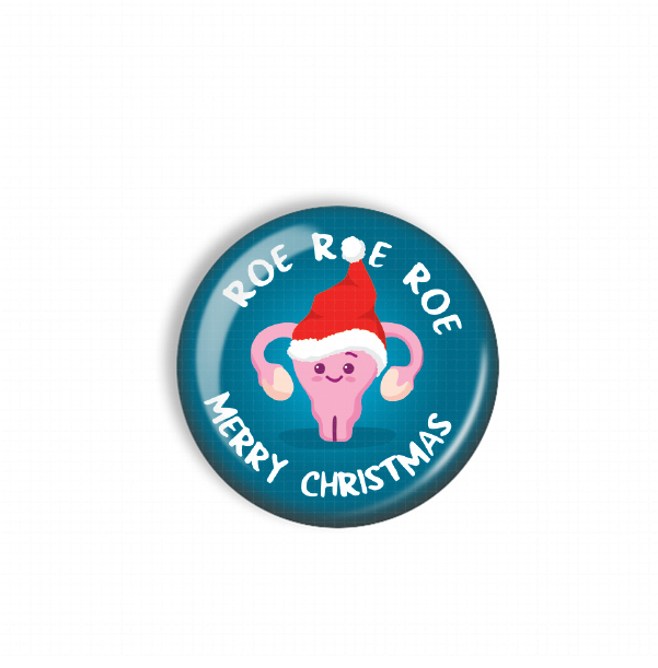 A blue button with a cartoon image of a pink character wearing a Santa hat and the text "Roe Roe Merry Christmas" around the edge.