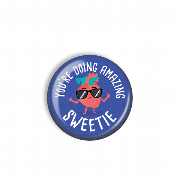 A blue button with a cartoon heart wearing sunglasses and the text "You're doing amazing Sweetie" printed on it.