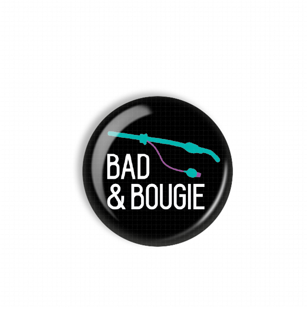 A black button with the text "BAD & BOUGIE" printed on it.