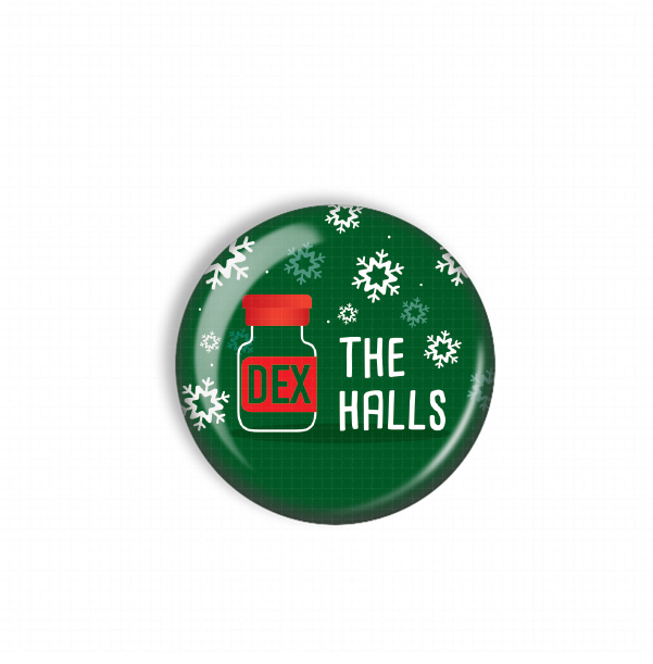 A green button with a red cap and the text "THE HALL'S" printed on it, surrounded by snowflakes.