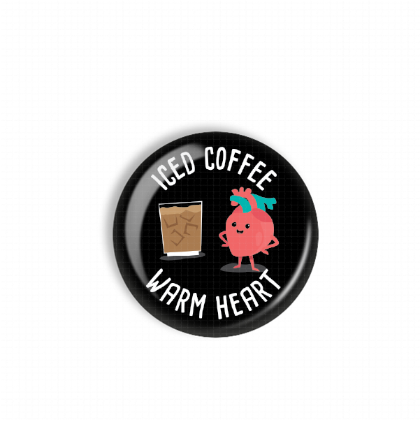 a black button with a playful design. The text on the button reads "Iced Coffee Warm Heart", accompanied by a cartoon character of a heart.