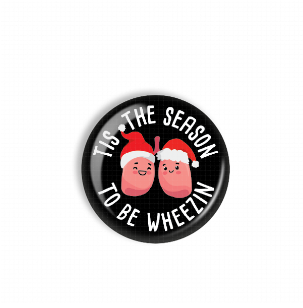 A black button with a white border and a playful design featuring two cartoon lungs wearing Santa hats.