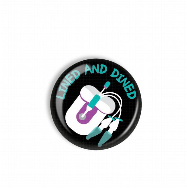 A black and white circular button with a graphic design featuring a toothbrush and the text "LINED AND DINED" in teal and purple colors.