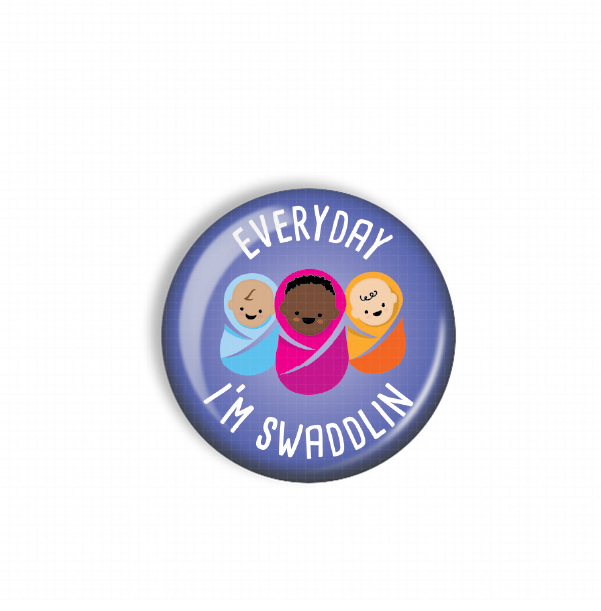 A blue button with three cartoon babies wrapped in blankets, along with the text "EVERYDAY I'M SWADDLEIN" printed on it.