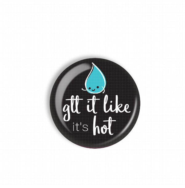 A black button with a water droplet and the text "glit it like it's hot" printed on it.