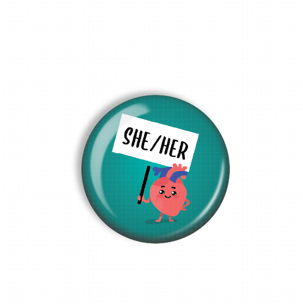 A round, green button with a cartoon heart character holding a sign that says "SHE/HER".
