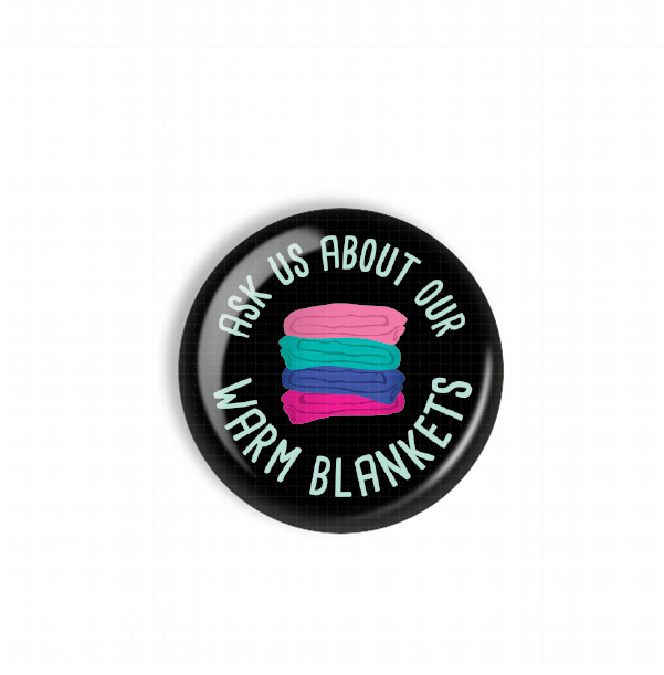 A black button with a colorful design and text on it.