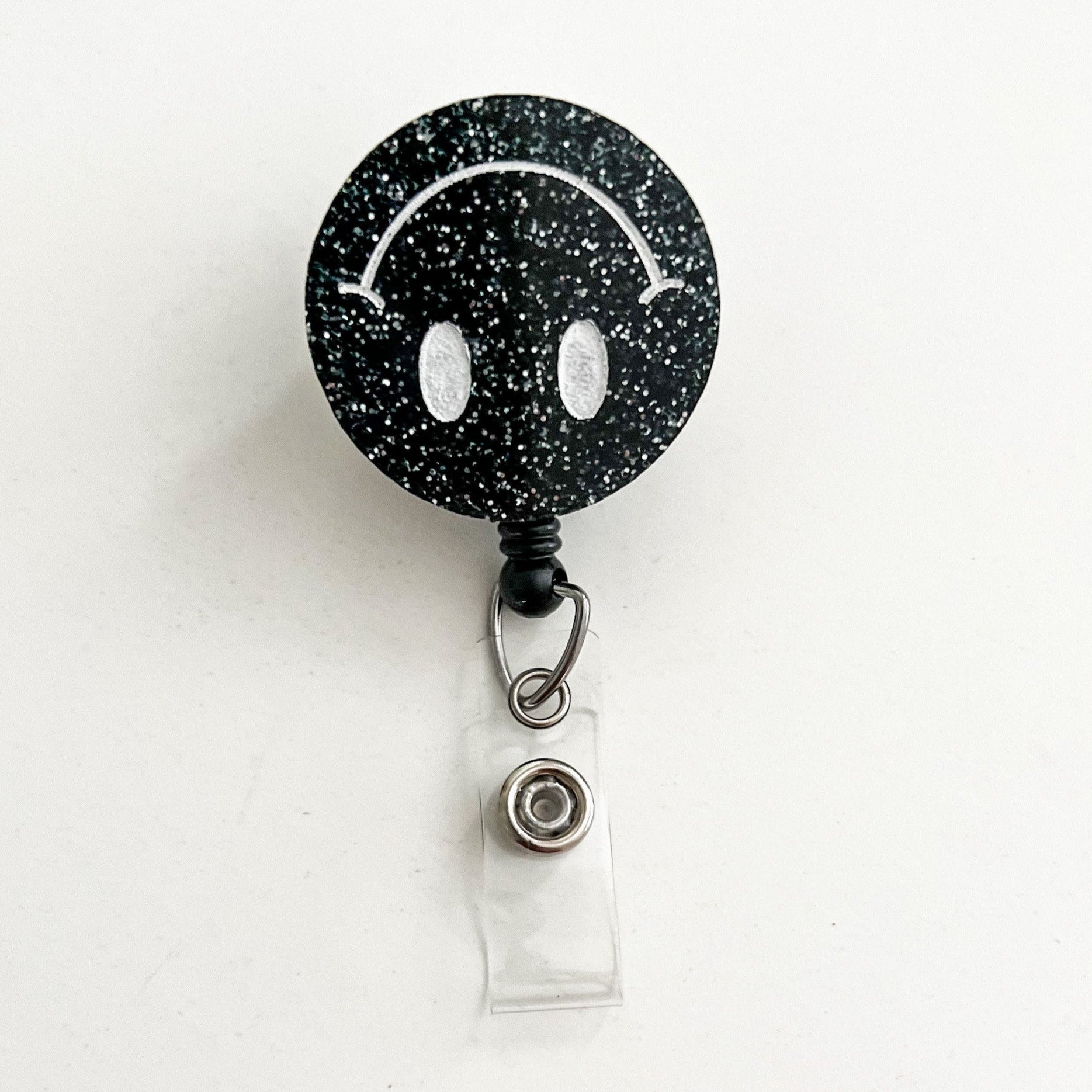 Glitter Badge Reel: Upside Down Smiley