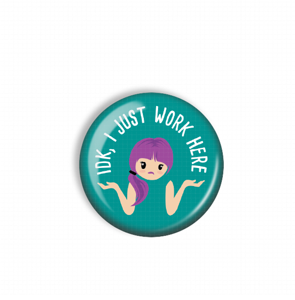 A round button with a cartoon girl and the text "I just work here" on it.