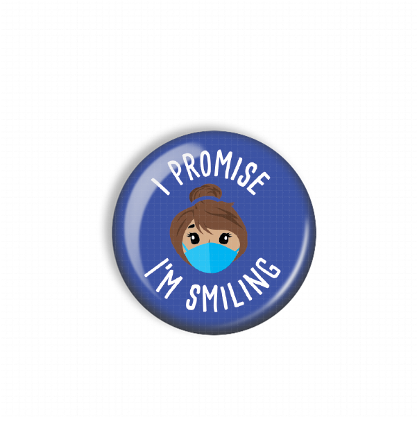 A blue button with a cartoon image of a person wearing a face mask and the text "I PROMISE I'M SMILING" printed on it.