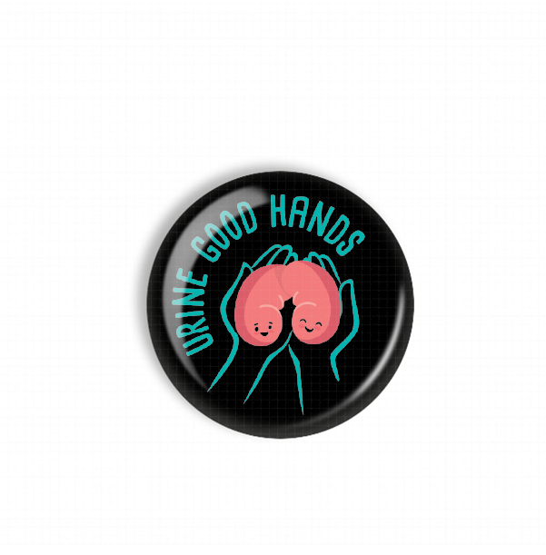 A black button with a graphic design featuring two cartoon hands holding a kidney with a smiley face. The text "DRINK GOOD HANDS" is written around the image.