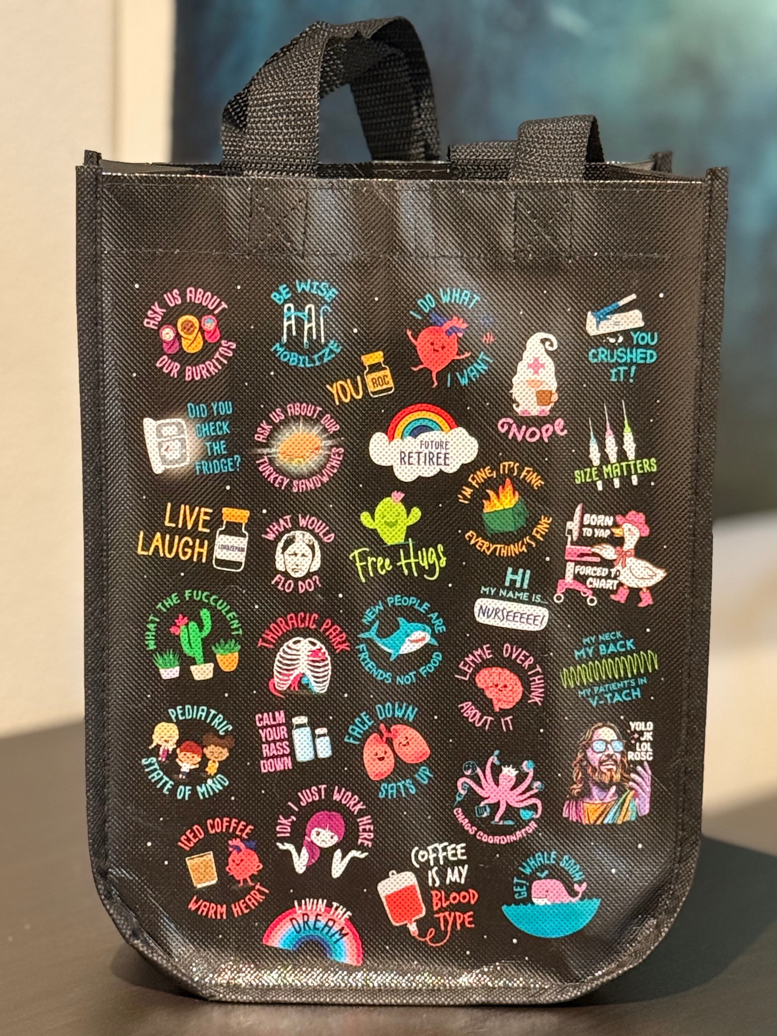 a black bag with a bunch of stickers on it
