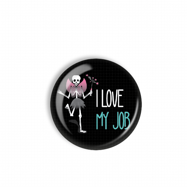 A black button with a skeleton and the text "I LOVE MY JOB" printed on it.
