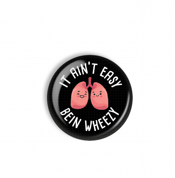 A black button with a cartoon image of two lungs and the text "IT AIN'T EASY BEIN WHEELY" printed on it.