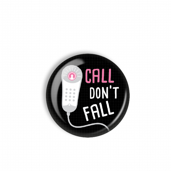 A black button with a white cord and a pink button, displaying the text "CALL DON'T FALL" in white letters.
